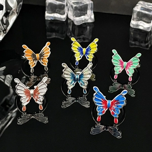Liquid butterfly open ring set with colorful gradient enamel finish on black background