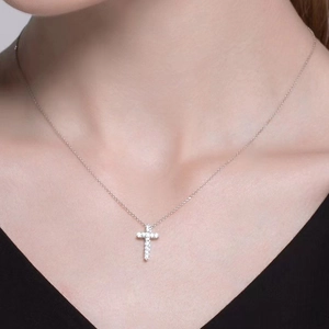 Elegant gold-plated cross pendant necklace with zircon crystals on a minimalist chain