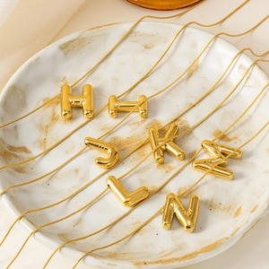 Polished gold bubble letter pendant necklace with elegant snake chain for women