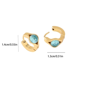 Macro view of gold vacuum plated 304 stainless steel earrings with sky blue crystal inlay