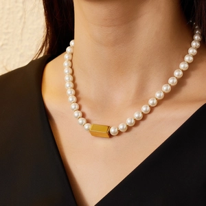 Elegant 18k gold plated pearl necklace featuring a central rectangular gold bar pendant