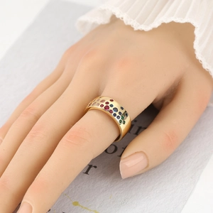 French vintage style gold wide ring with colorful cubic zirconia worn on hand