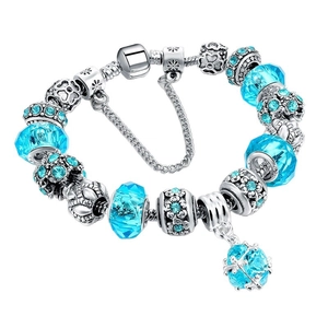 Boho style women's snake chain bracelet with light blue crystal beads and floral charms