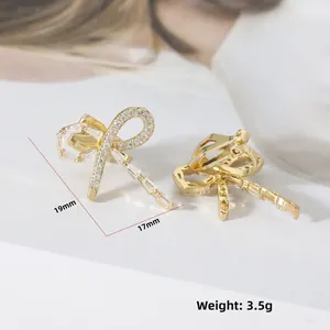 Elegant gold bow earrings with shimmering cubic zirconia, 19mm size, lightweight 3.5g