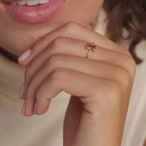 Champagne gold ring with rectangular zircon displayed on finger for elegant jewelry style