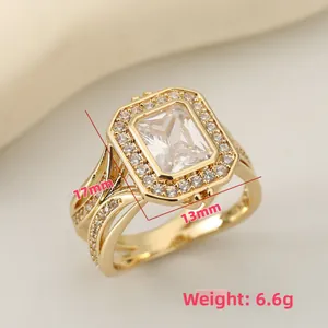 Macro view of square simulated diamond ring with tiered crossover band and size specs