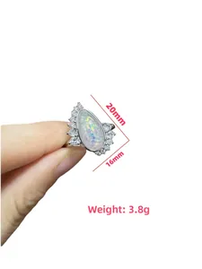 Detailed view of silver teardrop opal ring with diamond halo showing 20mm by 16mm size