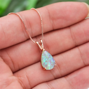 Rose gold water drop opal pendant necklace on box chain worn on neck