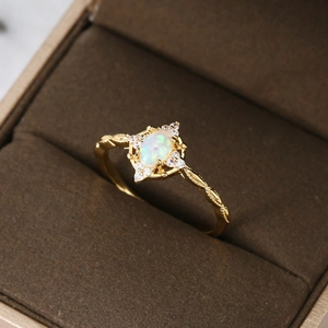 French vintage gold ring with oval white opal stone and pavé crystal accents