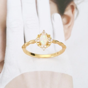 French vintage style ring with oval opal stone and sparkling zircon halo in gold finish