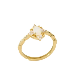 Adjustable gold ring with oval white opal stone and sparkling cubic zirconia halo