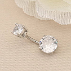 Close-up of silver belly ring featuring double sparkling round-cut cubic zirconia stones