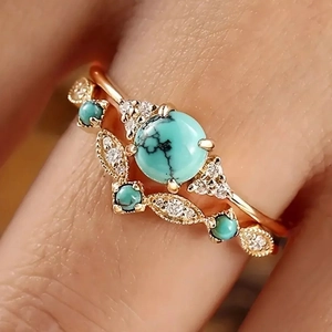 Bohemian style rose gold rings set with natural turquoise stone and leaf pattern