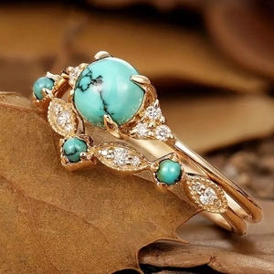 Bohemian gold ring featuring turquoise stone and sparkling cubic zirconia accents