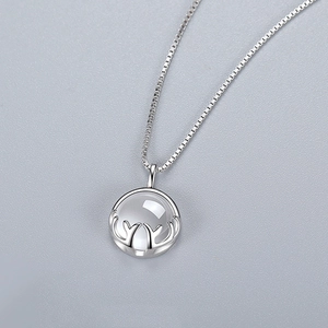 Silver deer antler necklace with round opal stone pendant on a delicate box chain