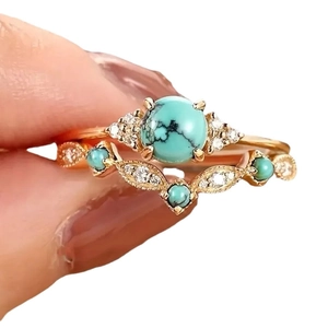 Bohemian double-layered gold rings set featuring green turquoise stones and diamonds
