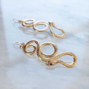 Exquisite golden snake winding earrings with realistic scale texture and dark gem eyes