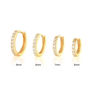 Detailed size comparison of gold huggie earrings in 6mm to 9mm with zircon inlay