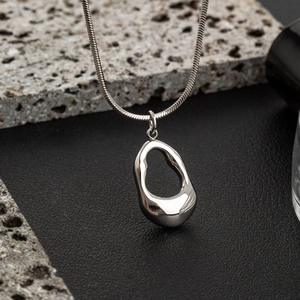 Minimalist silver hollow teardrop pendant on snake chain with liquid metal finish