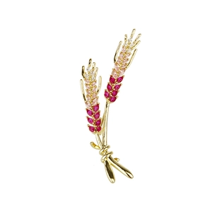 Eleganter goldener Weizenbrosche mit rosa Zirkonia-Verlauf und Seidenbandschleife