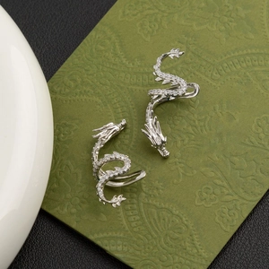 Silver dragon shaped ear cuffs with sparkling crystals in a vintage Chinese style design