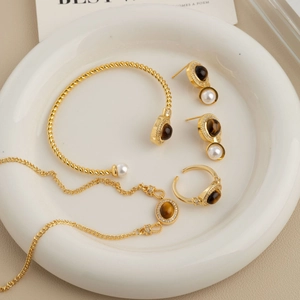 French vintage tiger eye and pearl jewelry set with gold necklace, bracelet, and ring