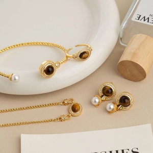 French vintage jewelry set with tiger eye stone and pearls including ring and necklace