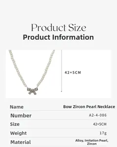 Detailed view of bow pendant necklace with pearls, including size and weight dimensions