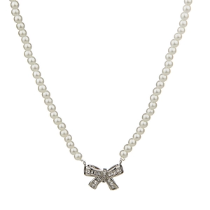 French vintage bow pearl necklace with zircon pendant on a pure white background
