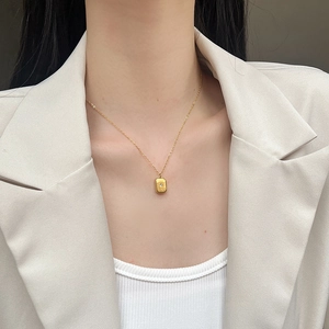 French vintage gold titanium steel necklace with star pendant worn on collarbone