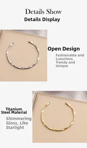 Detail of Mobius twist bangle in gold and silver finish made of titanium steel