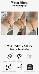 Detail of twisted Mobius titanium steel cuff bracelet in gold and silver finishes
