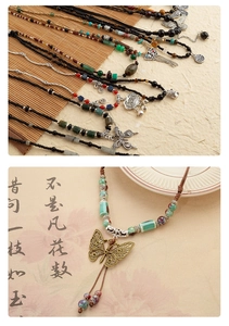 Gedetailleerde macro-opname van de retro kralenketting met een traditionele Chinese hanger