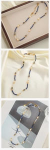 Close-up of blue lapis, white pearls, and crystals necklace in elegant jewelry box