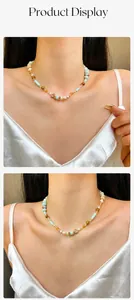 Detailed view of handmade beaded necklace with natural stones and freshwater pearls