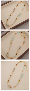 Detail of beaded necklace with blue natural stone, pearls and gold lobster clasp