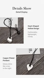 Macro-opname van zilveren hart hanger met Want More gravure en koperen beplating