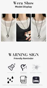 Detail van een zilveren hart hanger aan zwart koord met sieraden verzorgingsinstructies