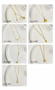 Detailed grid of Chinese style 18K gold plated necklaces featuring lucky Fu character charms