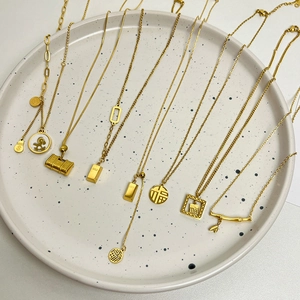 Vintage gold necklaces collection featuring Fu character and gold brick pendants for women