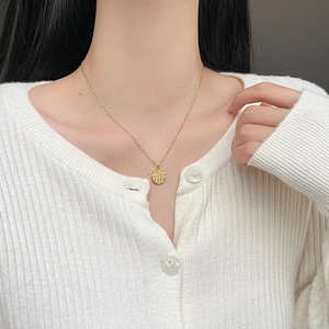 Vintage Chinese style gold Fu character pendant necklace on a delicate steel chain