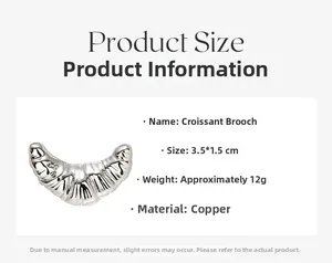 Detail view of croissant brooch with dimensions 3.5x1.5cm made of copper material