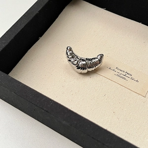 Chic silver croissant brooch with pleated texture in premium jewelry gift box display