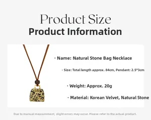 Detailed view of bag-shaped stone pendant with gold metal handle on long necklace