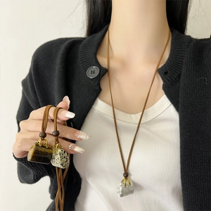 Long tiger eye stone bag pendant necklace on brown cord with wooden beads and gold clasp