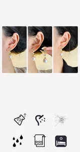 Detalle de pendientes de copo de nieve con circonitas y perlas en modelo elegante