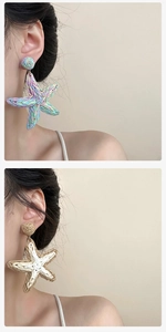 Detail view of woven starfish earrings in colorful raffia and natural beige tones