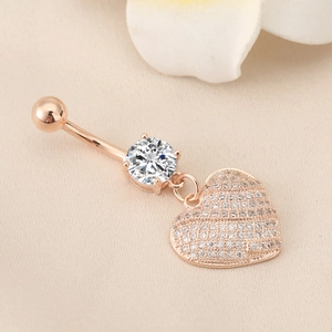 Rose gold stainless steel belly ring featuring a heart pendant and white cubic zirconia