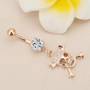 Rose gold skull belly button ring with sparkling zircon stones and floral decoration