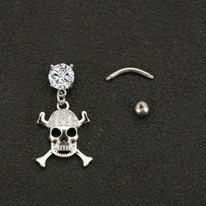 Punk style stainless steel skull belly ring with sparkling zircon stones on black background